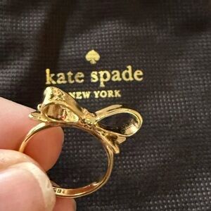 Kate Spade gold bow ring. Beautiful great condition Never worn Comes with pouch